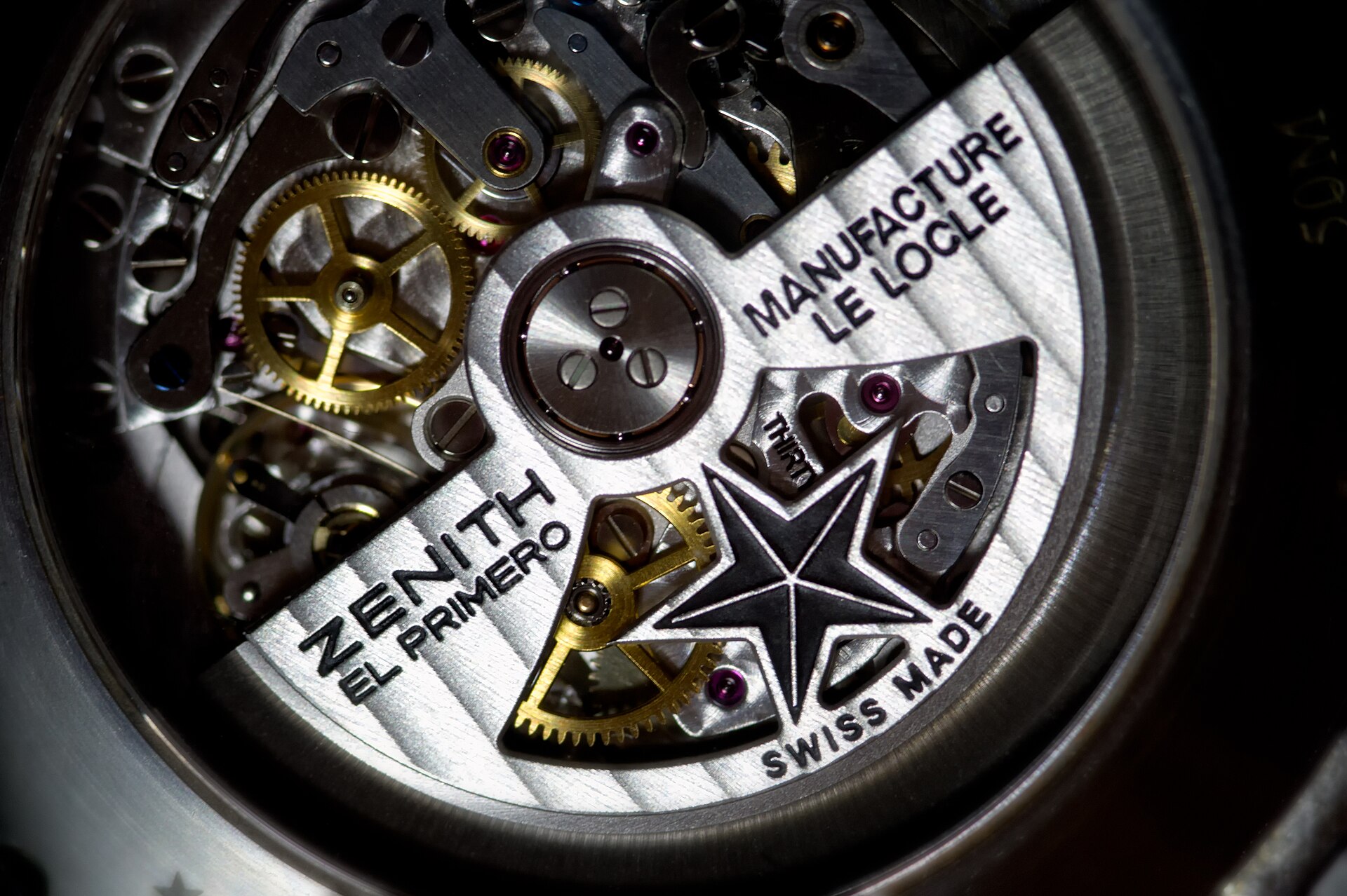 Close-up of a Zenith El Primero automatic chronograph movement with the star rotor engraved El Primero