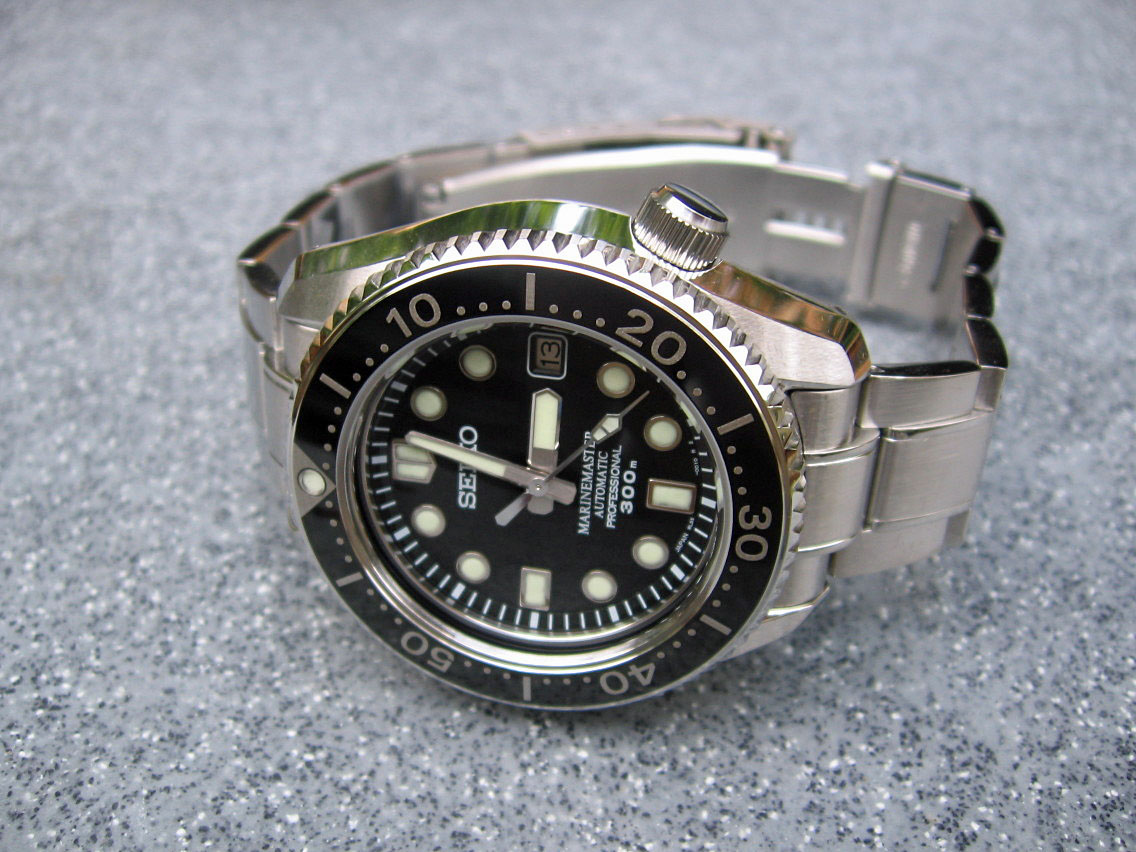 A Seiko Marinemaster Professional 300 m SBDX001 with a black dial on a steel bracelet
